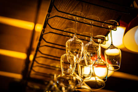 Wine glasses hanging on the ceilingの写真素材
