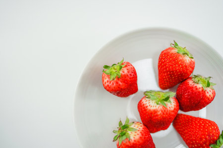Fresh strawberry and white dishesの写真素材