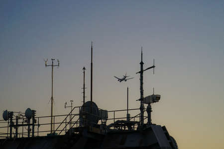A plane flying over Tokyo (Haneda new flight route). Shooting Location: Tokyo metropolitan areaの写真素材