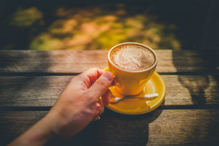 Yellow cup cafe latte. Shooting Location: Kamakura City, Kanagawa Prefecture