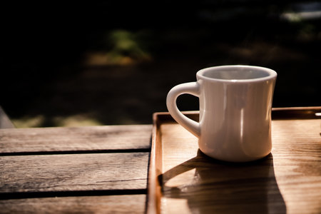Coffee cup on the terrace seat. Shooting Location: Kamakura City, Kanagawa Prefectureの写真素材