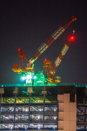 Construction cranes and Yokohama Minato Mirai cityscape. Shooting Location: Yokohama-city kanagawa prefectureの写真素材