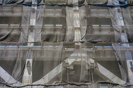 Scaffolding of buildings under construction. Shooting Location: Minato -ku, Tokyoの写真素材