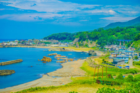 Blue sea and fishing village in Yamagata prefecture. Shooting Location: Yamagata Prefectureの写真素材