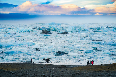 Landscape of glacial lake and tourists. Shooting Location: Iceland