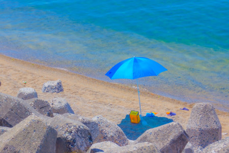 beach umbrella and sandy beach. Shooting Location: Akita prefectureの写真素材