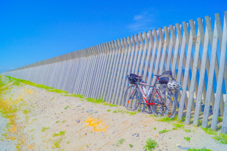 cycling along the sandy beach. Shooting Location: Akita prefectureの写真素材