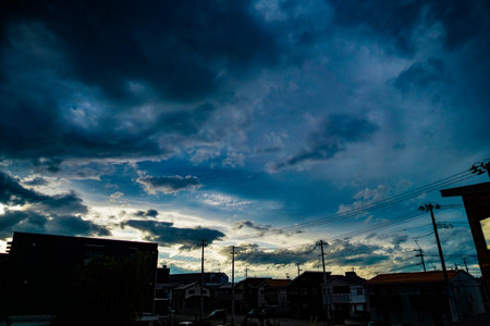 Electric wire and sky at sunset.の写真素材