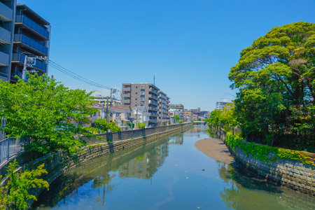 Blue sky and river scenery of Hoshikawa, Yokohama City. Shooting Location: Hodogaya Ward, Yokohama Cityの写真素材
