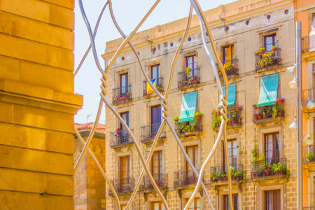 Building through decorative fence. Shooting Location: Spain, Barcelonaの写真素材