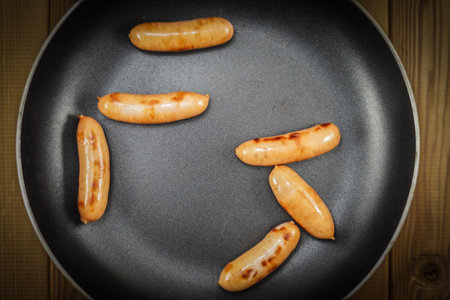 Sausage fried in a frying pan. Shooting Location: Kanagawa Ward, Yokohama Cityの写真素材