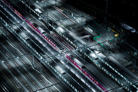 A fleet of vehicles illuminated in pale blue. Shooting Location: Minato Ward, Tokyoの写真素材