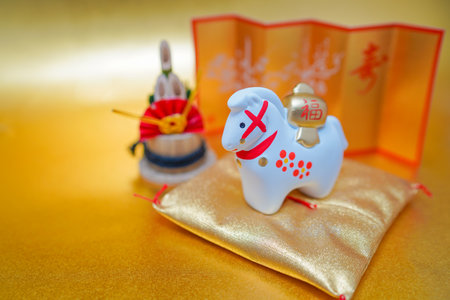 Horse figurine and gold cushion. Shooting Location: Kanagawa Ward, Yokohama Cityの写真素材
