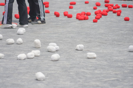 Red and white balls scattered on the ground. Shooting Location: Kanagawa Ward, Yokohama Cityの写真素材