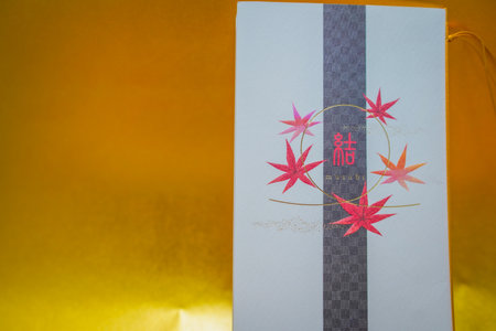 Japanese pattern gift box on yellow background. Shooting Location: Kanagawa Ward, Yokohama Cityの写真素材