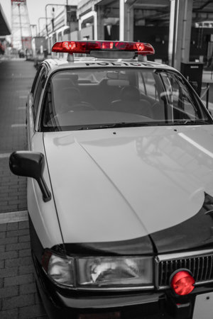A police car with its red lights shining. Shooting Location: Izumi Ward, Yokohama City