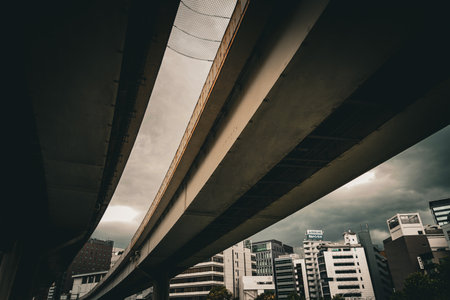 An elevated road stretching into the cloudy sky. Shooting Location: Chuo Ward, Tokyoの写真素材