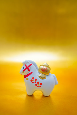 Figurine on a gold background. Shooting Location: Kanagawa Ward, Yokohama Cityの写真素材