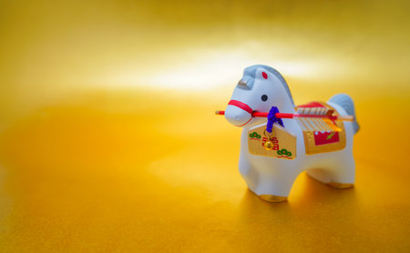 A clay bell holding a hamaya arrow. Shooting Location: Kanagawa Ward, Yokohama Cityの写真素材