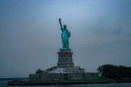 Cloudy sky and the Statue of Liberty. Shooting Location: Manhattan, New York