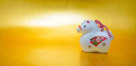 Year of the Horse Clay Bell and Gold Margin. Shooting Location: Kanagawa Ward, Yokohama Cityの写真素材