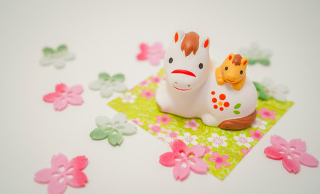 Horse and child and cherry blossom decorations. Shooting Location: Kanagawa Ward, Yokohama Cityの写真素材