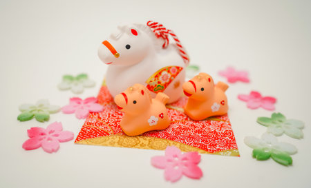 Horse and child figurine surrounded by cherry blossoms. Shooting Location: Kanagawa Ward, Yokohama Cityの写真素材