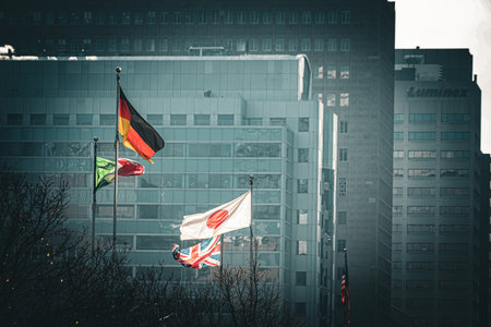 Flags in front of buildings in winter. Shooting Location: Toronto