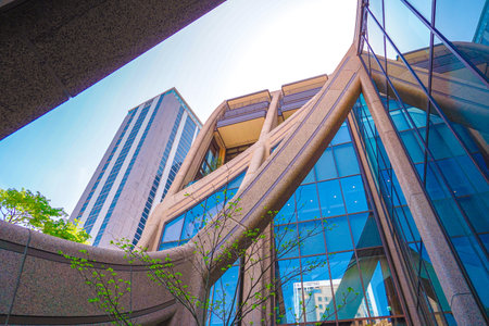 Looking up at the curved architecture of Azabudai Hills. Shooting Location: Minato Ward, Tokyo