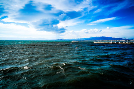Rough waves of Sagami Bay overlooking the harbor. Shooting Location: Fujisawa City, Kanagawa Prefectureの写真素材
