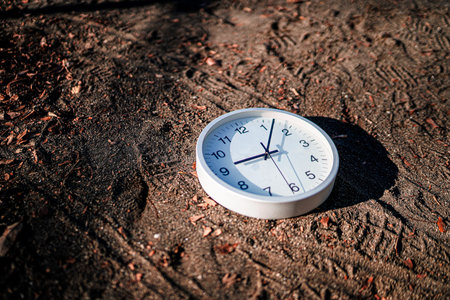 A white clock placed on the ground. Shooting Location: Kanagawa Ward, Yokohama City