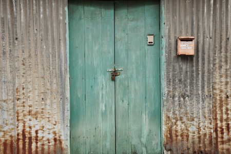 The Zinc Wall with Blue Doorの写真素材