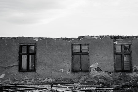 Black and white photo of a demolished village house.