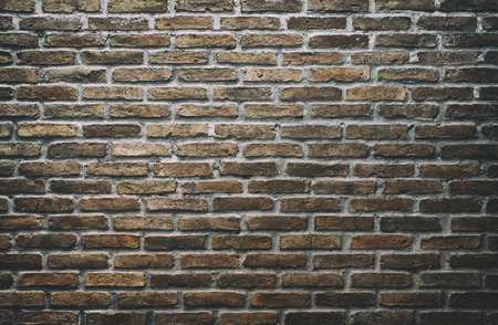 Old brick wall in a background image, put grain for vintage style