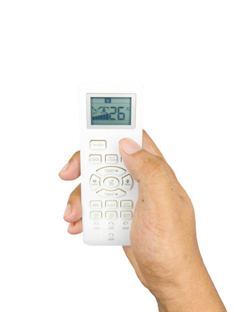 Hand holding remote control isolated on white background.の写真素材