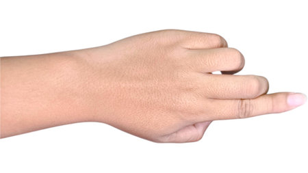 A human hand making a pointing gesture with the index finger on a white background.の写真素材