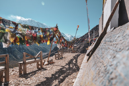 Praying flags against snowcapped mountainsの写真素材