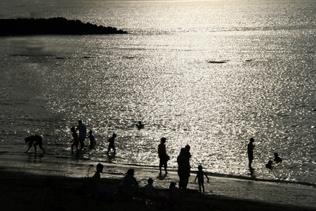 Sunset silhouette of peopleの写真素材