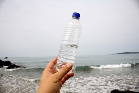 Shoot above the beach at the beach clean, bottled waterの写真素材