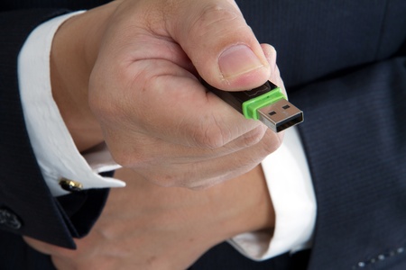 A business man with an usb disk  on hand