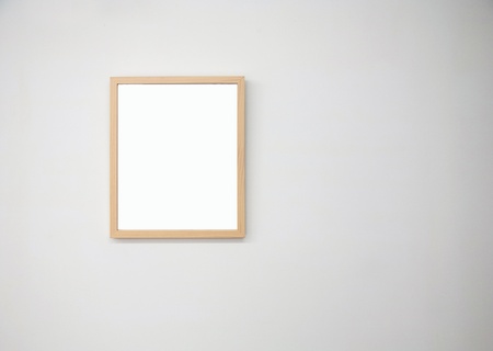 wood photo frame on wallの写真素材