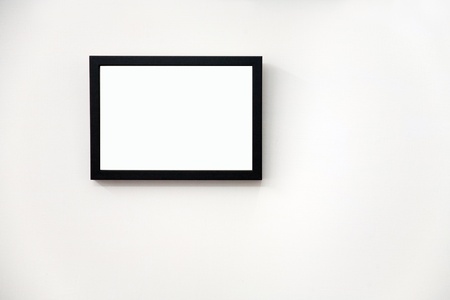 wood photo frame on wallの写真素材