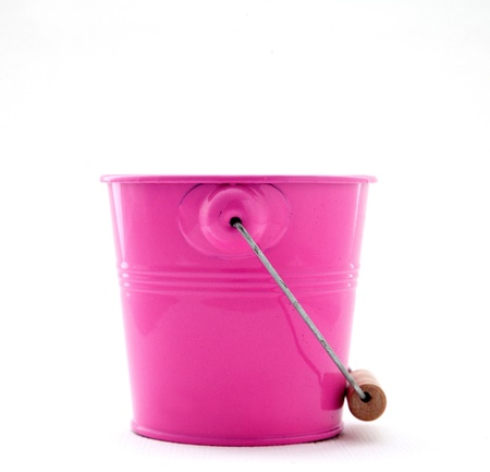 Small iron milling red bucket on whiteの写真素材