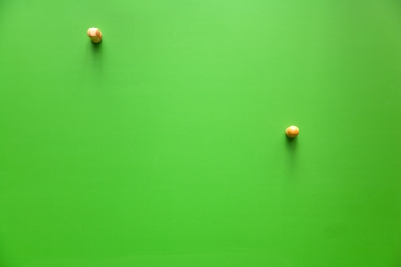 wood hanger on green wallの写真素材