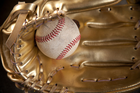 golden glove with baseball golden gloveの写真素材