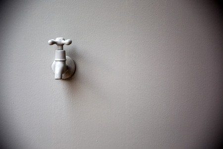 wall and a bird faucetの写真素材
