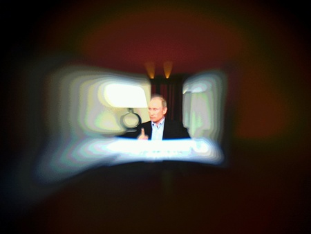 Russian President Vladimir Putin. Speech on TV on aesthetic lensbaby lens.の素材
