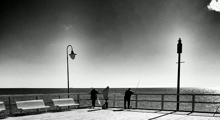 Fishing on the pier, Gdynia Orlowo, Poland.の素材