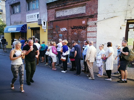 Buying tastiest ice cream in the best ice cream shop in the Old Town. Gdansk, Poland.