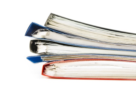 Colored office files are stacked isolated on white